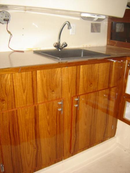 yes, i did it all myself.  Applied teak veneer with epoxy, then epoxy over it with special hardner.  New bar sink from home depot.